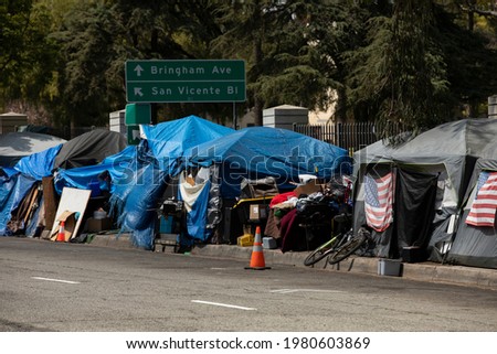 A homeless encampment sits on a street in Downtown Los Angeles, California, USA. Royalty-Free Stock Photo #1980603869