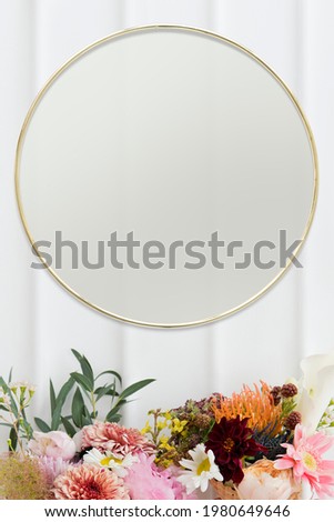 Golden floral frame on white wall