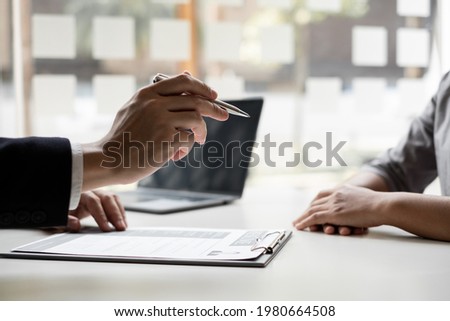 Interview employee talking about resume and job description with job applicants sitting in front in the office, Job applications concepts. Royalty-Free Stock Photo #1980664508