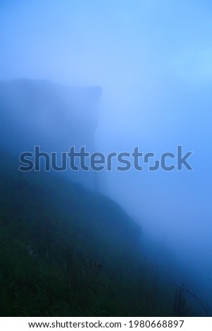 Mountain Peaks covered with fog and cloud in the rainy season. (The pictures has noise and soft focus)