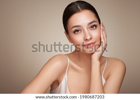 Portrait beautiful young woman with clean fresh skin. Model with healthy skin, close up portrait. Cosmetology, beauty and spa Royalty-Free Stock Photo #1980687203
