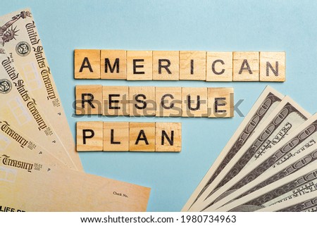 USA dollars background. American rescue plan, USA relief program, stimulus check and Act of 2021 concept. Money, business, profit and livelihood idea Royalty-Free Stock Photo #1980734963