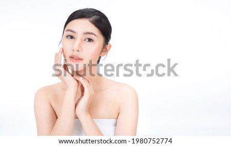 Closeup portrait of beauty asian woman with fair perfect healthy glow skin hand touching cheek isolated on white, young beautiful asia girl with pretty smile on face. Beauty korean spa skincare banner Royalty-Free Stock Photo #1980752774