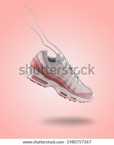 Woman Sneaker on light pink gradiënt background, woman fashion, sport shoe concept, floating idea, air, product photography, trendy shoes, levitation concept, street wear