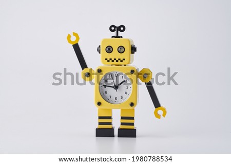 A cute robot clock reminds people about innocent childhood. It's easy to use as a photo editing element, as it's shoot with on white background.