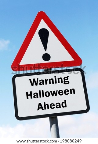 Red and white triangular warning road sign with a warning of Halloween ahead concept against a partly cloudy sky background 