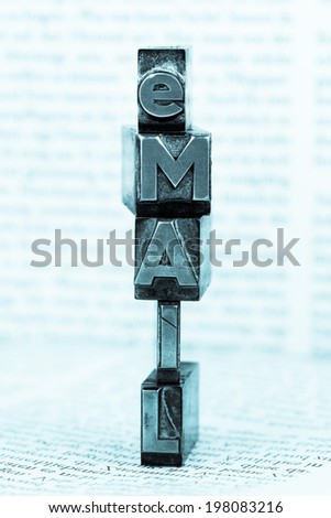 the word "e-mail" in lead letters written. symbolic photo for quick correspondence