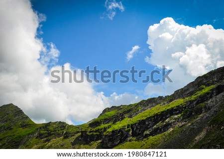 Beautiful mountain landscape with clouds	and sky.