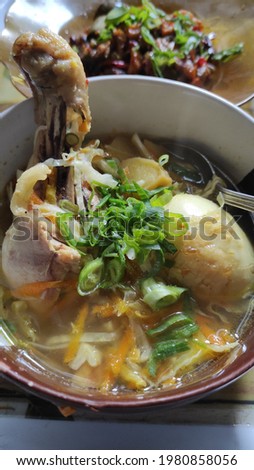 Chicken Soto which consists of grated carrots, cabbage, chicken and eggs, then flush with yellow sauce using special spices