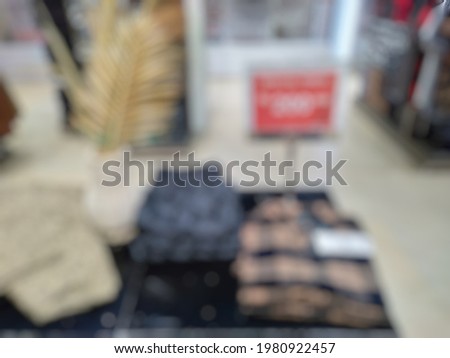 Defocused Abstract image of display menswear Department store sign. Sale concept. Modern trade, use for background.
