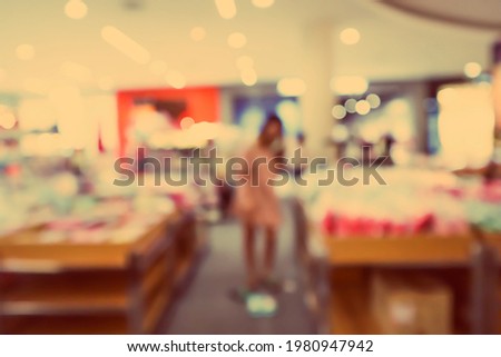 Abstract blur background crowd people in shopping mall for background.