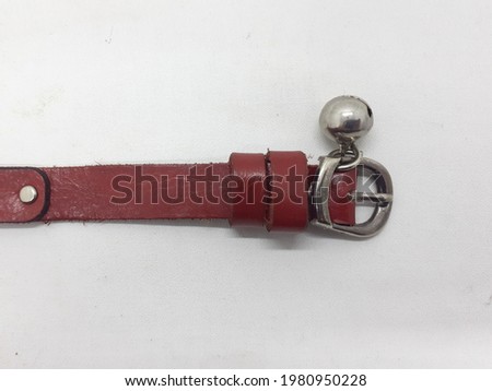 Red Leather Animal Cat or Dog Neck Identification Belt with Silver Bell in White Isolated Background
