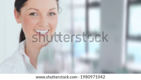 Composition of smiling female caucasian scientist working in laboratory and copy space. research and science concept digitally generated image.