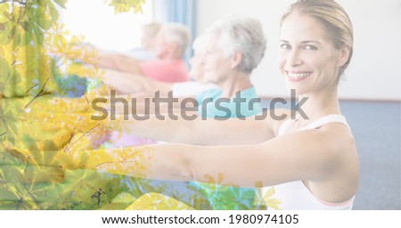 Composition of female instructor and senior women exercising in fitness class with tree overlay. retirement, fitness and active lifestyle concept digitally generated image.