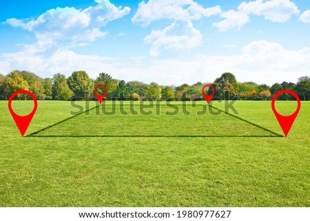 Land plot management - real estate concept with a vacant land on a green field available for building construction and housing subdivision in a residential area for sale, rent, buy or investment. Royalty-Free Stock Photo #1980977627