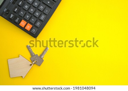 Calculator House Keys Concept of buying and selling housing, mortgages and renting a house or apartment