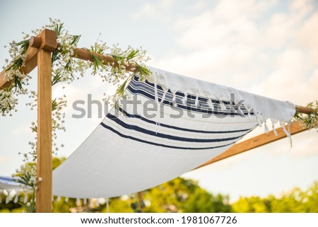 Close up of Chuppah canopy cloth details for traditional Jewish wedding custom Royalty-Free Stock Photo #1981067726
