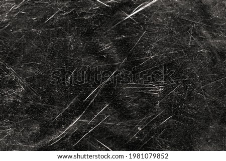 White scratches and dust on black background. Vintage scratched grunge plastic broken screen texture. Scratched glass surface wallpaper. Dirty Blackboard.  Royalty-Free Stock Photo #1981079852