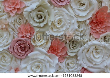 Background of colorful paper roses background in a wedding reception with soft flowers. Decorate for a wedding party. The flower arranged a wedding vintage.