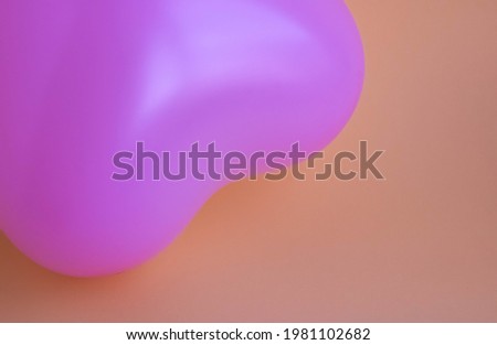 Purple balloon in the shape of a heart on a pink background. Wedding concept, Valentine's Day, photo zone, lovers. Banner. top view