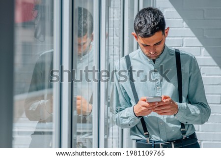 businessman with mobile phone in office