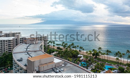 Aerial Shot of the Ocean and Island Over-looking Hotel Rooftop in Maui