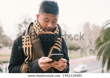 Man using his mobile phone.