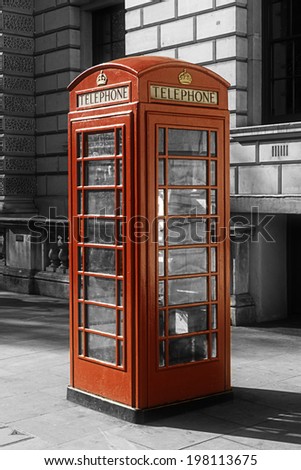 Black and white image with a color London phone box 