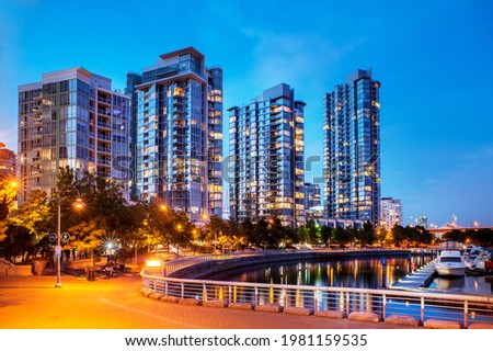 Apartment condominium towers in Vancouver's Yaletown neighbourhood at dusk.   Royalty-Free Stock Photo #1981159535