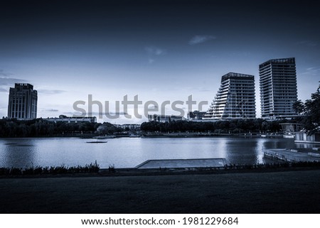 Modern commercial building at sunset by the small lake