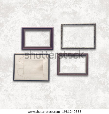 wooden photo frames on white wall