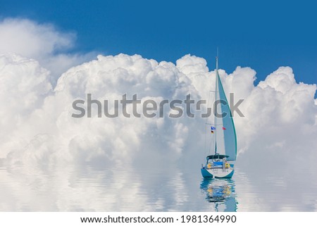 Sailing yacht in a stormy weather and clouds