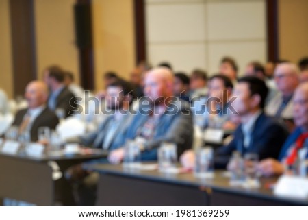 A blurry picture of a business man At the seminar in the hotel