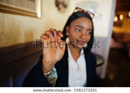 Young deaf mute african american woman using sign language.