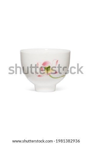 Subject shot of white tea bowl with picture of lotus flower. Fine ceramic bowl is isolated on the white background.