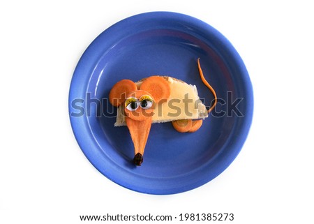 Food art creative concepts. Cute mouse made of cheese, bread and carrots vegetables isolated on a white background.