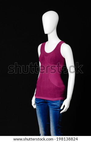 Mannequin female red shirt and jeans isolated on black 