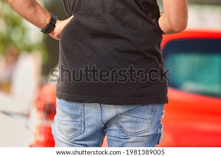 Man waiting to cross a street. Urban life. Pedestrian