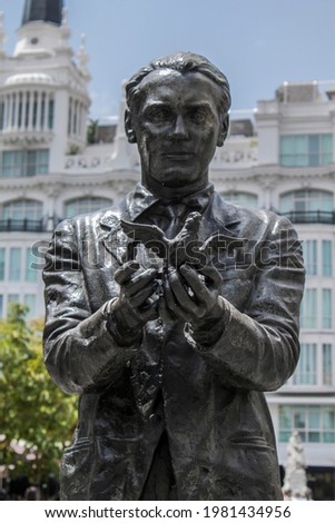 Historical statue of the famous poet, Federico García Lorca with a pigeon on Saint Anne Square (Plaza de Santa Ana) in Madrid, Spain, Europe. Old town neighborhood in the true inner city of Madrid.