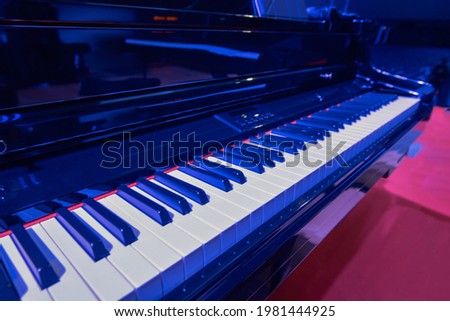 Piano key on stage blue light