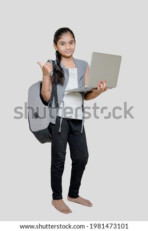 A young Indian girl is attending online school or classes. Study in lock down as Schools closed due to Covid-19. Role of technology during nationwide lock down. Learning at home concept in India