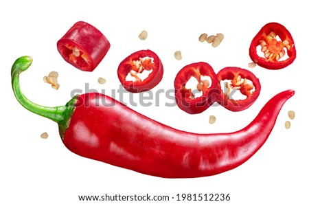 Fresh red chilli pepper and cross sections of chilli pepper with seeds floating in the air.  White background. File contains clipping paths. Royalty-Free Stock Photo #1981512236