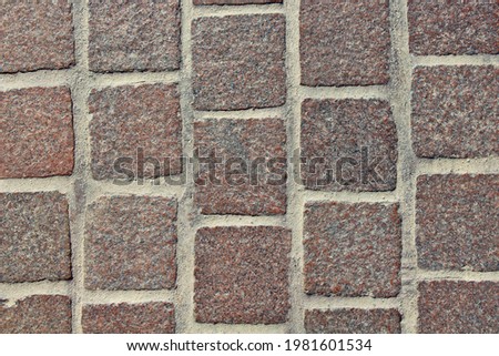 Old square paving stones. Close-up. Top view. Background. Texture.