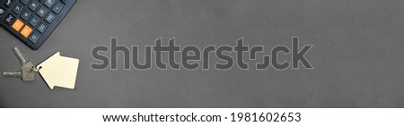 Panorama Banner Calculator House and Apartment Keys on a Grey Background Concept Buying an Apartment House