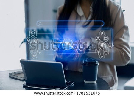 Businesswoman hand using smartphone with laptop payments online shopping at modern office desk, Customer support virtual interface icons screen, Blurred background.