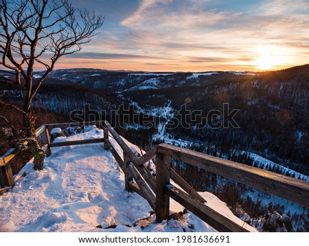 sunset at the hahnenkleeklippen in the harz