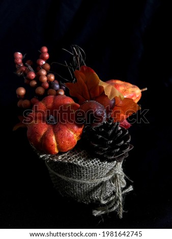 October floral arrangement. Beautiful autumnal decoration with pumpkins and cones. Gives you warmth and good mood.