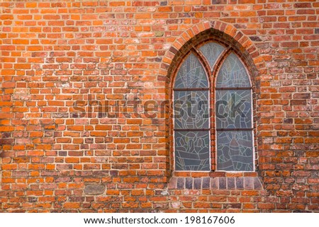 Victorian window on the wall of brick