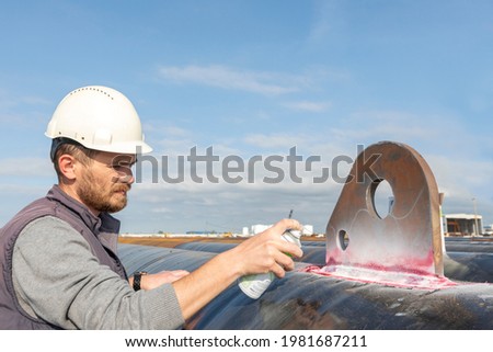 View of the dye penetrant inspection, also called liquid penetrate inspection or penetrant testing (PT). It is a widely applied and low-cost inspection method used to check surface-breaking defects. Royalty-Free Stock Photo #1981687211