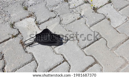 Thrown mask in the street